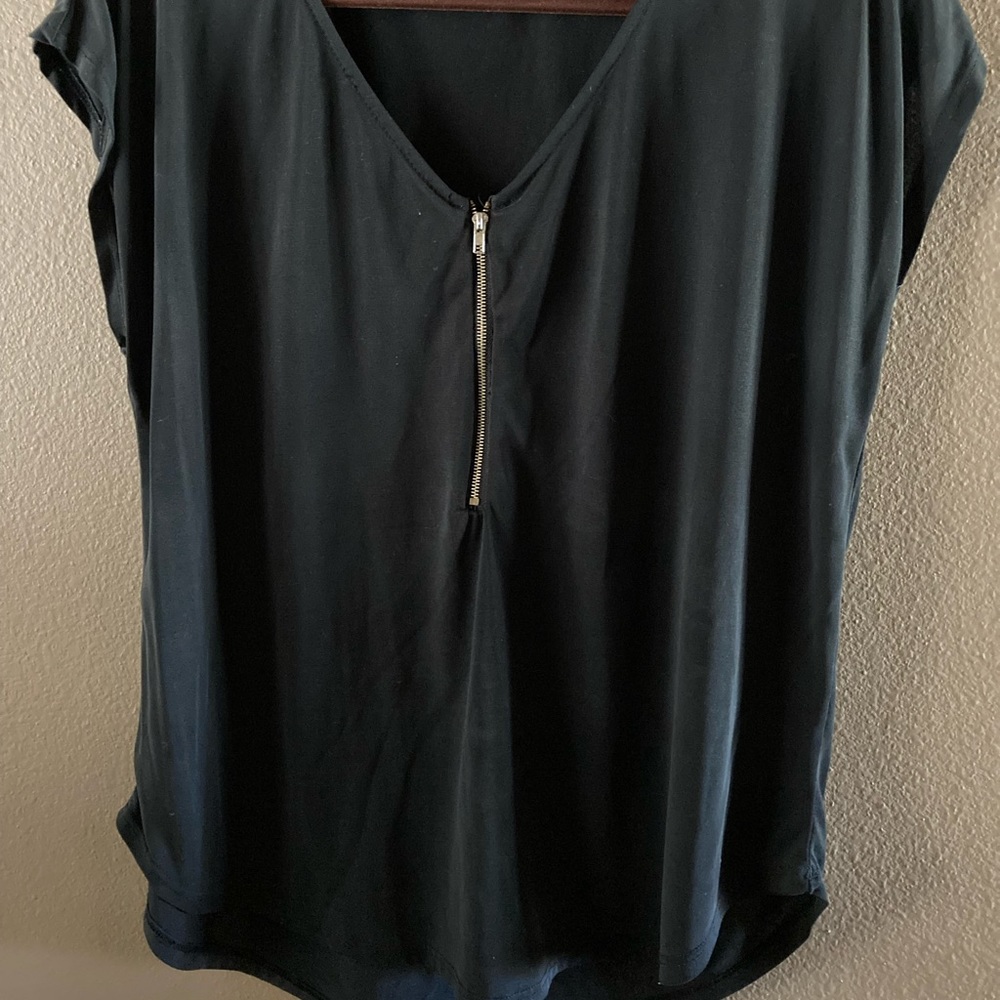 A Dark gray blouse with gold zipper detailing